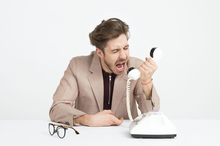 man-yelling-into-phone Getting Your Prospect to Respond